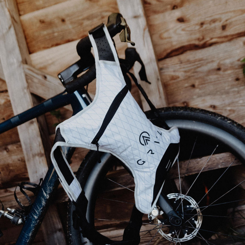 gravel cyclist white hydration pack bikepacking | grvl