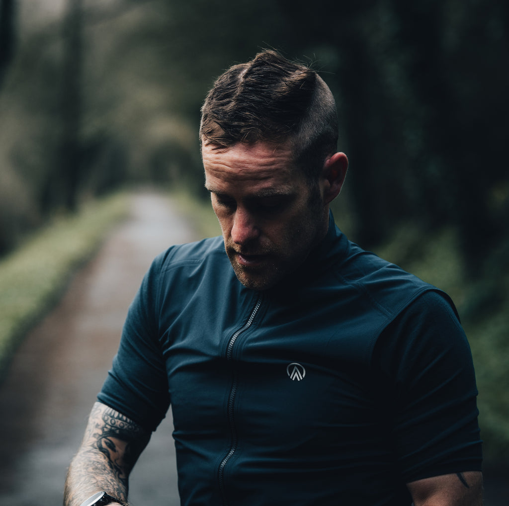 sustainable recycled polyester cycling gilet for gravel cycling with reflective detailing 